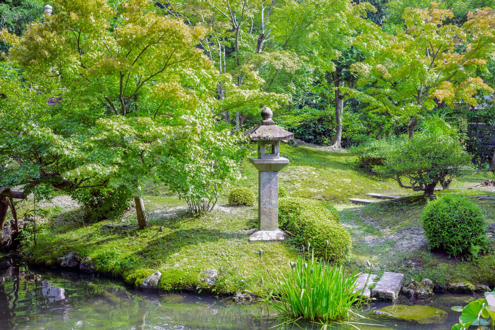 Zen landscape garden with stone lantern and pond at Koun-ji Temple